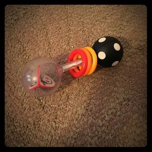 A baby rattle, a dog toy and high hill flip flops
